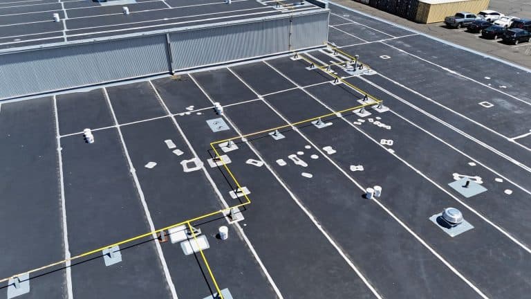 Aerial view of roof after emergency repair and coating.
